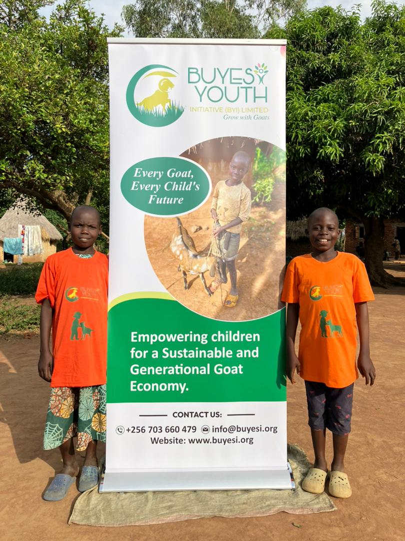 Children standing with Buyesi Youth Initiative banner
